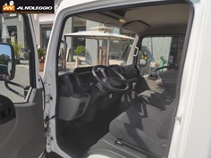 Furgone Nissan NT400 container sponda - Vista laterale con sponda 